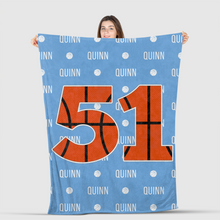 Load image into Gallery viewer, girl holding basketball blanket with custom name and number
