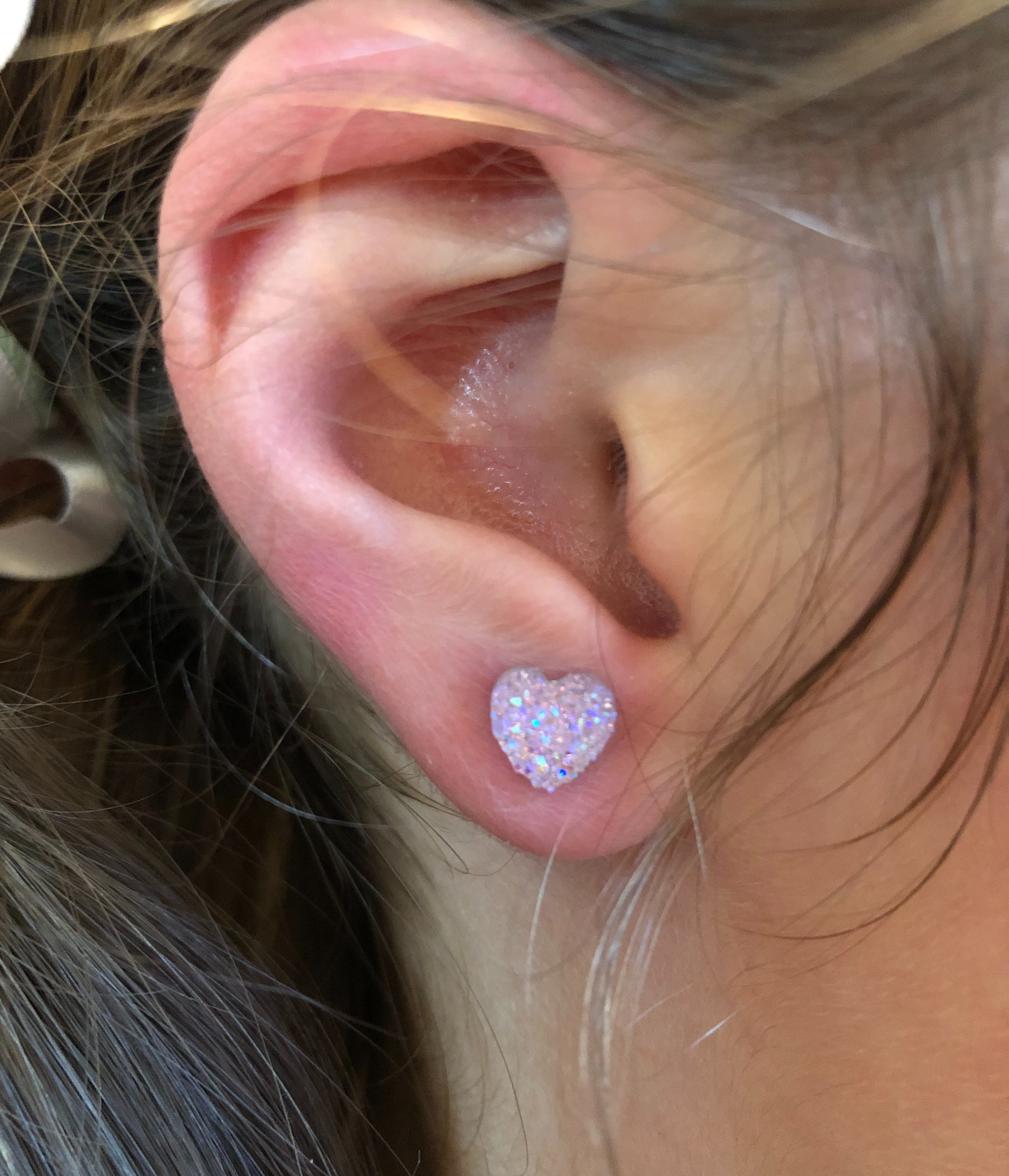Valentine Earrings - Leopard Heart - model wearing light pink heart earrings
