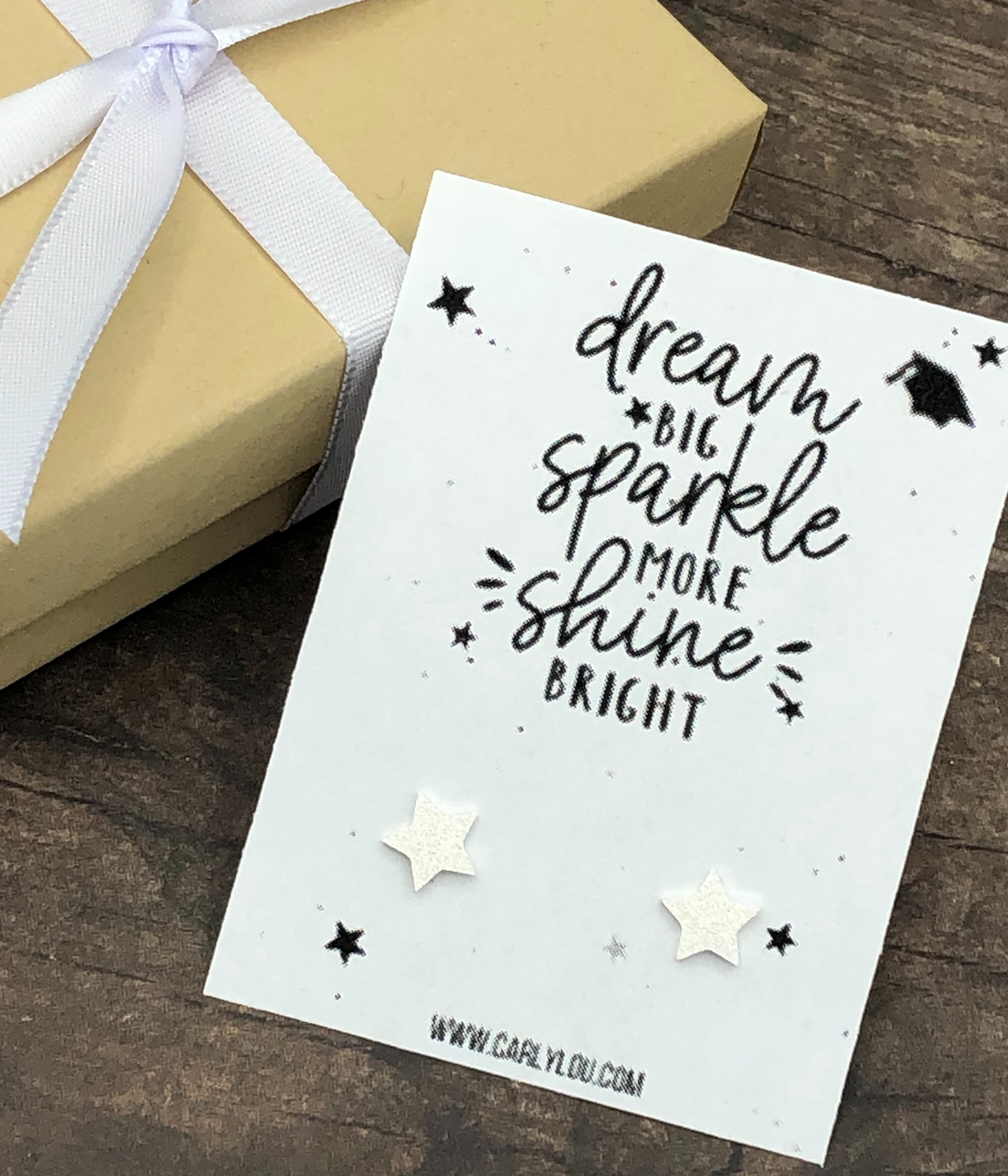 Dream Big Sparkle More Shine Bright Graduation Earrings Closeup Silver