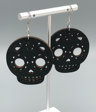 Load image into Gallery viewer, Skeleton Black Wood Earrings perfect for Halloween closer shot
