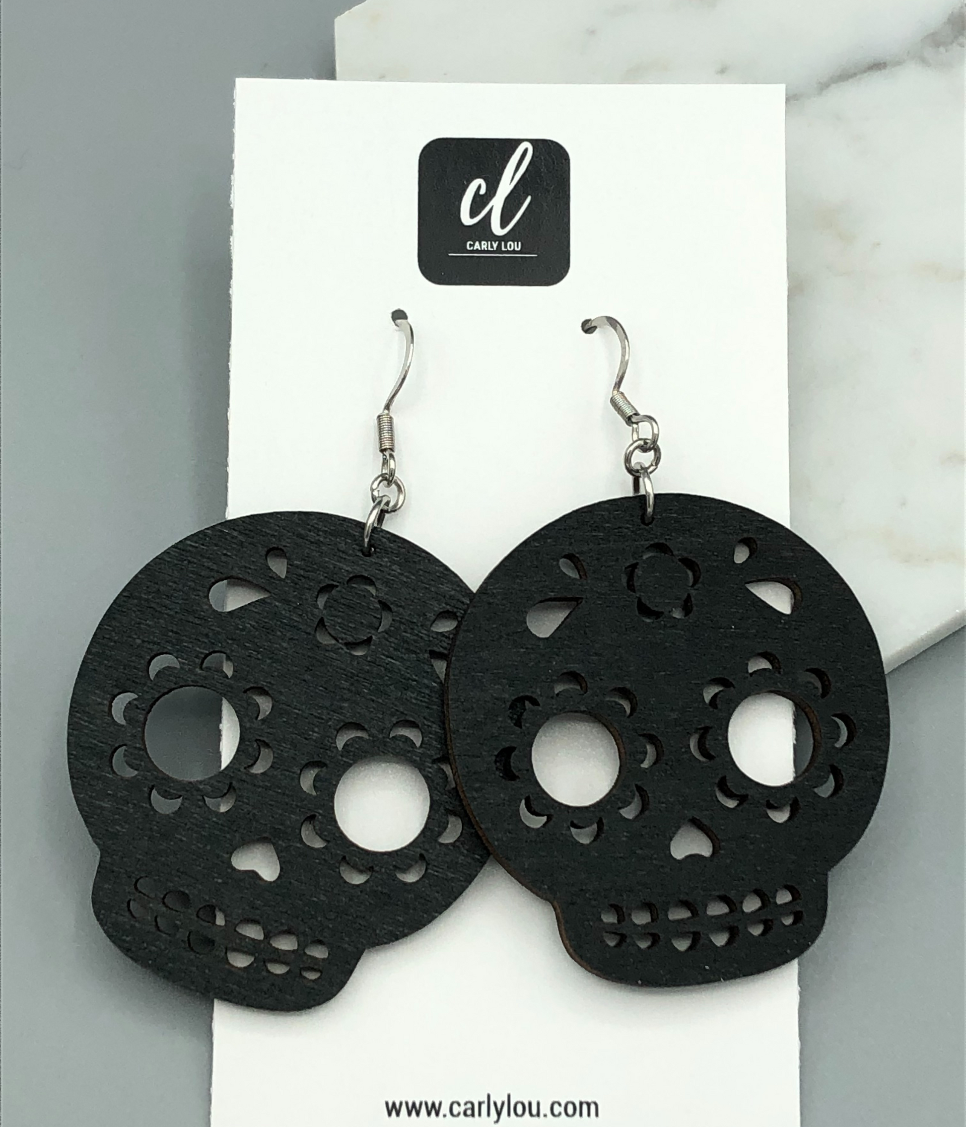 Skeleton earrings on jewelry card